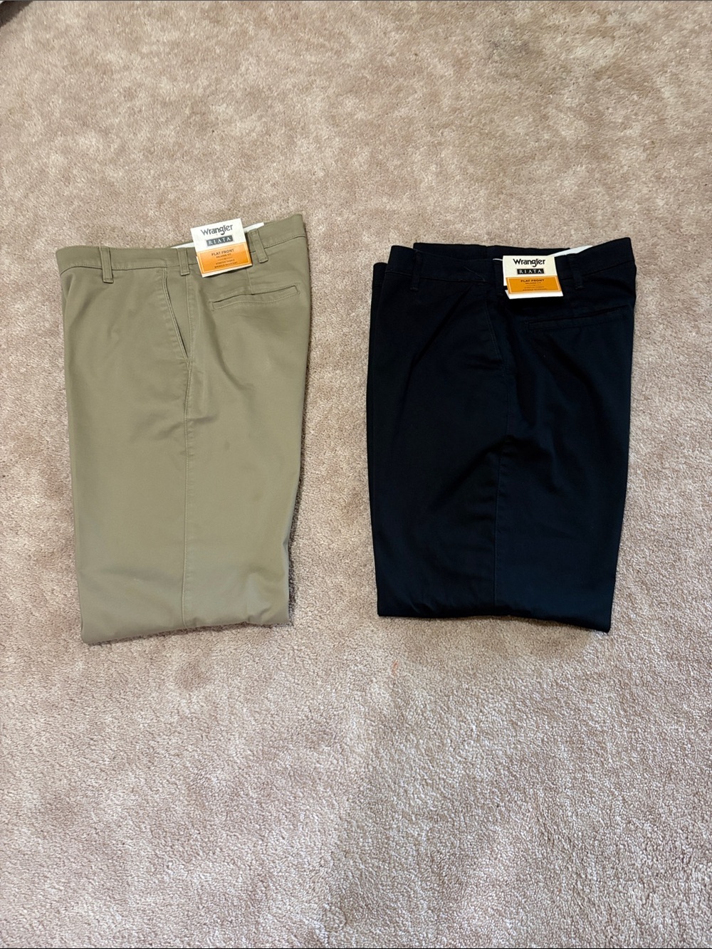 Wrangler men’s Riata flat front pants.
